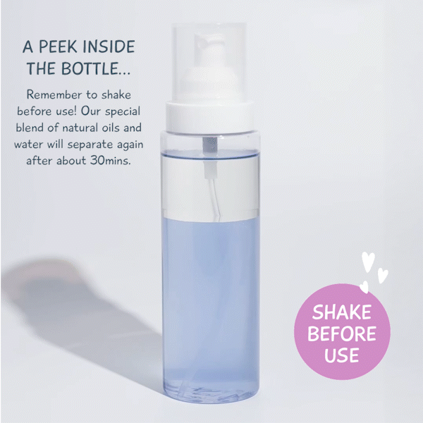 Transparent bottle showing MooGoo Baby & Child Natural Detangling Spray formula, natural oils and water separation with shake before use