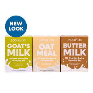 Three MooGoo soap bars in different flavors with a 'New Look' label on a white background. MooGoo Natural Cleansing Bar Trio on white background, with Buttermilk, Oatmeal and Goat’s Milk, non-drying soap bars for sensitive and dry skin SLS-free