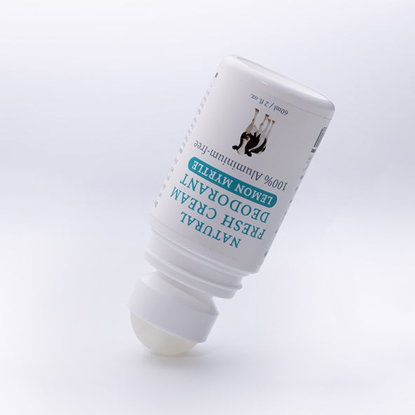 MooGoo Coconut Cream deodorant roll-on displayed open on soft white surface, natural aluminium free formula for sensitive underarms