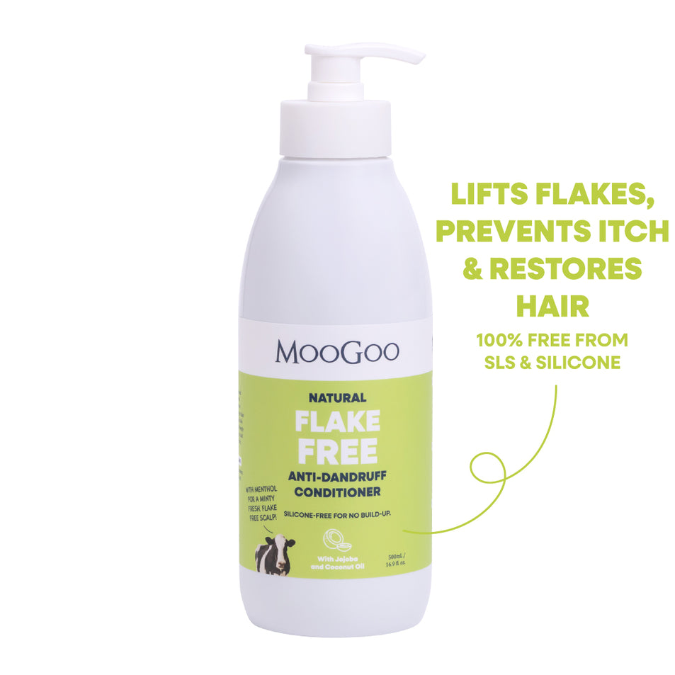 MooGoo Natural Flake Free Anti-Dandruff Conditioner in a white pump bottle with a light green label, shown on a white background with promotional text on the right. 00ml pump bottle with silicone free formula with jojoba and coconut oil to restore dry scalp.