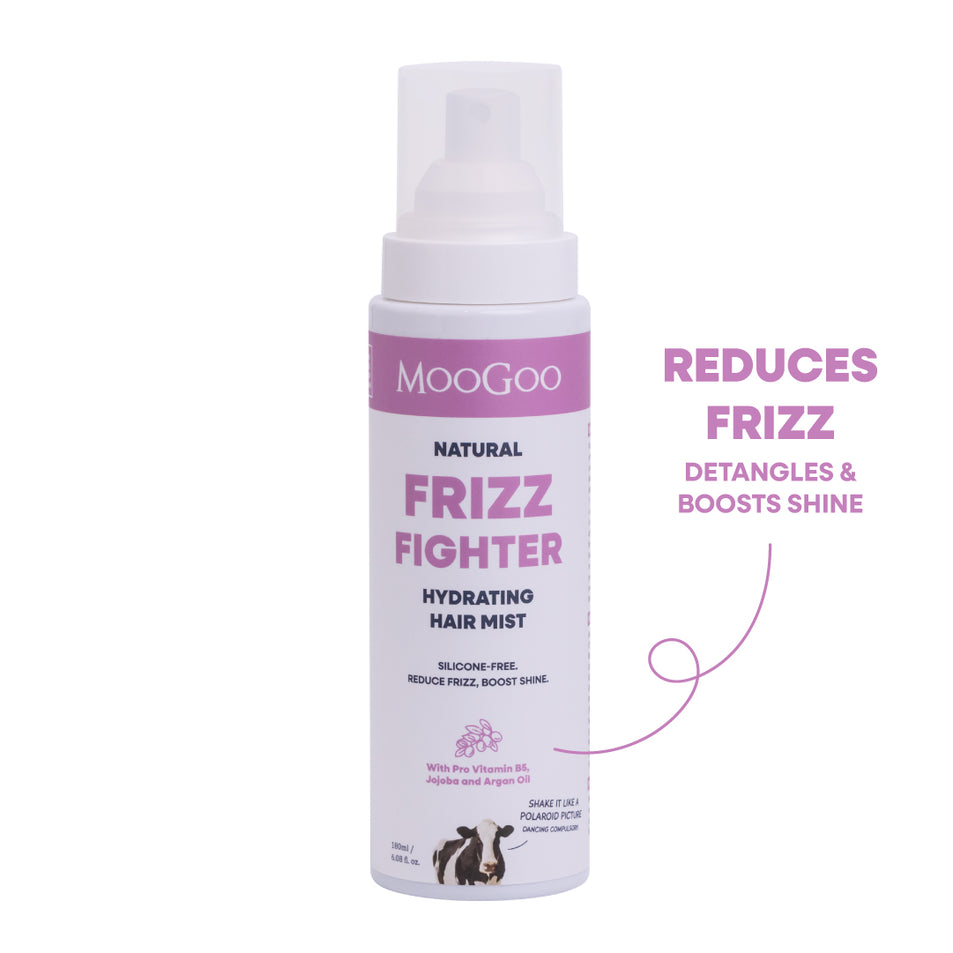 MooGoo Natural Frizz Fighter Hydrating Hair Mist in a white spray bottle with pink and black text, shown on a white background. Silicone-free frizz spray with jojoba oil and pro vitamin B5. 