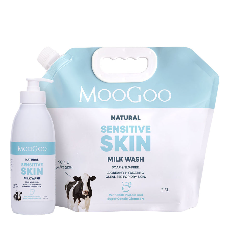 MooGoo Natural Sensitive Skin Milk Wash set, featuring a 2.5L refill pouch and a 500ml pump bottle, both in white and light blue packaging with a cow graphic. MooGoo Milk Wash 500ml pump and 2.5L bulk refill set photographed on white background, low-irritant cleanser for face and body, paraben and SLS free