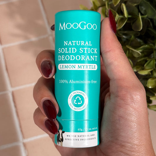 MooGoo Natural Solid Stick Deodorant Lemon Myrtle held in hand  eco packaging aluminium free deodorant for effective odour control